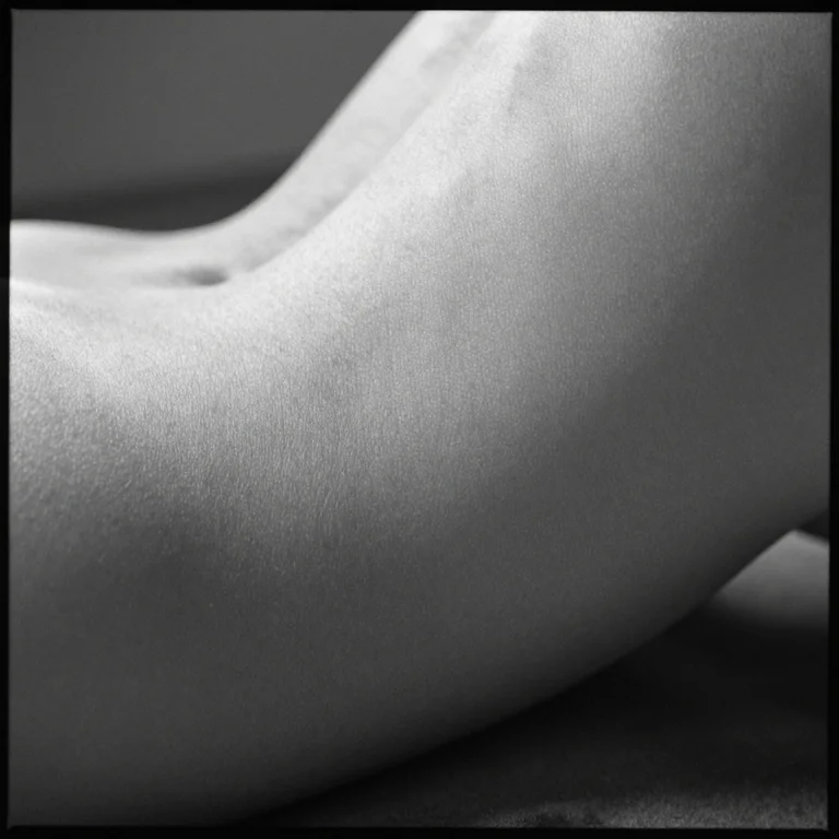 A black-and-white AI close-up of an adult torso with fine skin texture and soft tonal transitions