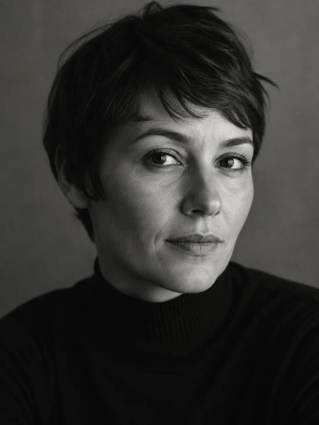 Black and white portrait of an adult woman in a dark turtleneck